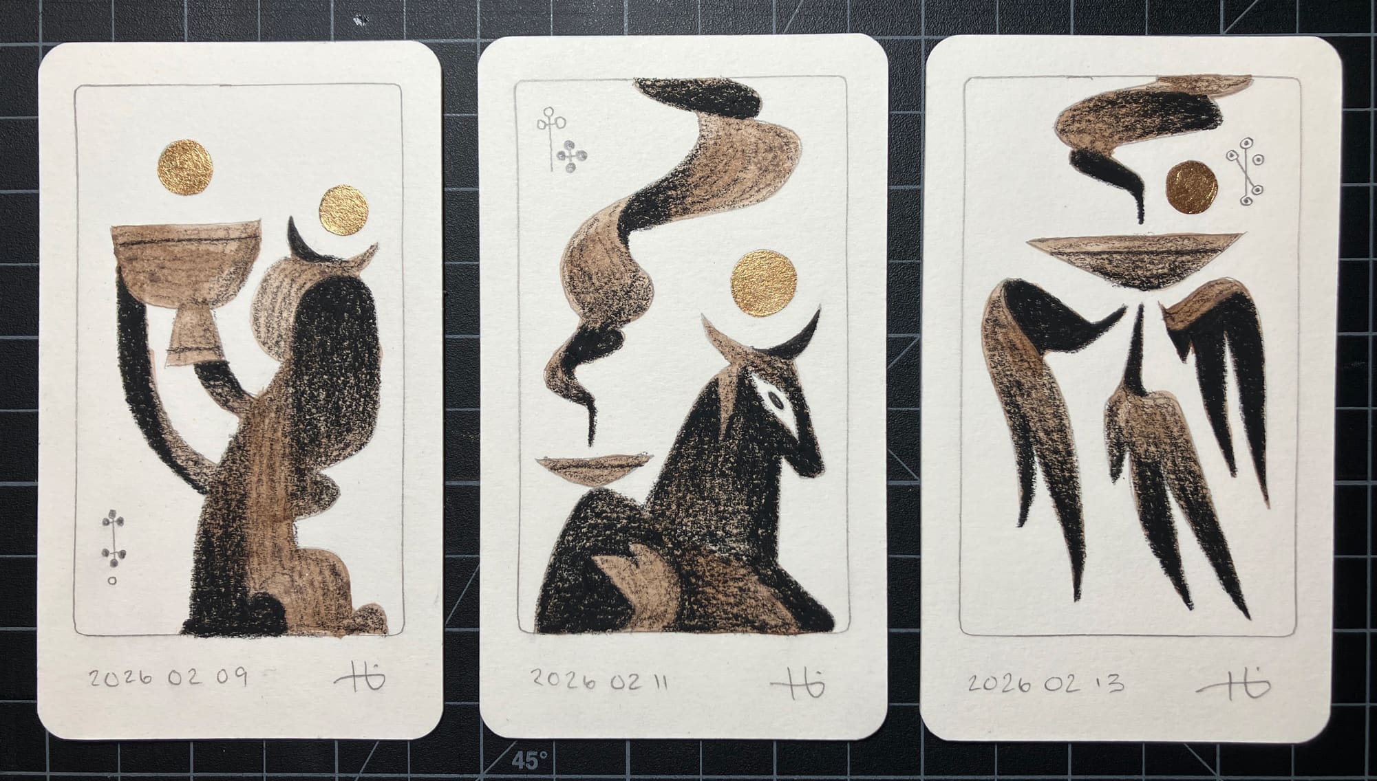 Three original drawings on tarot-size cards depict a figure holding a cup aloft, a sitting cow-like figure, and a winged bowl emanating incense smoke. The drawings are rendered in graphite, brown ink, conte pencil, and bronze paint.