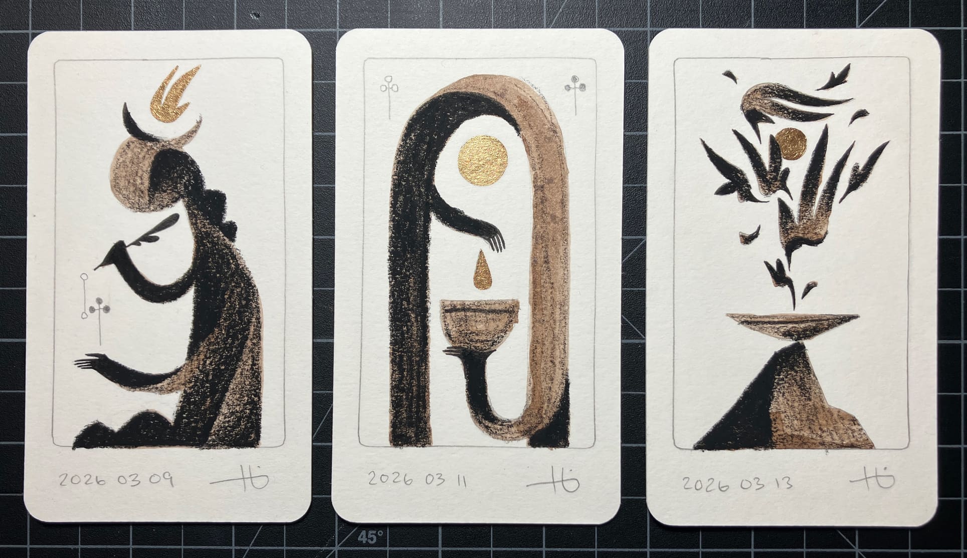 Three original drawings on tarot-size cards depict a horned figure with a quill, an archway with hands, and a flurry of wings and feathers over an offering bowl. The drawings are rendered in graphite, brown ink, conte pencil, and bronze paint.